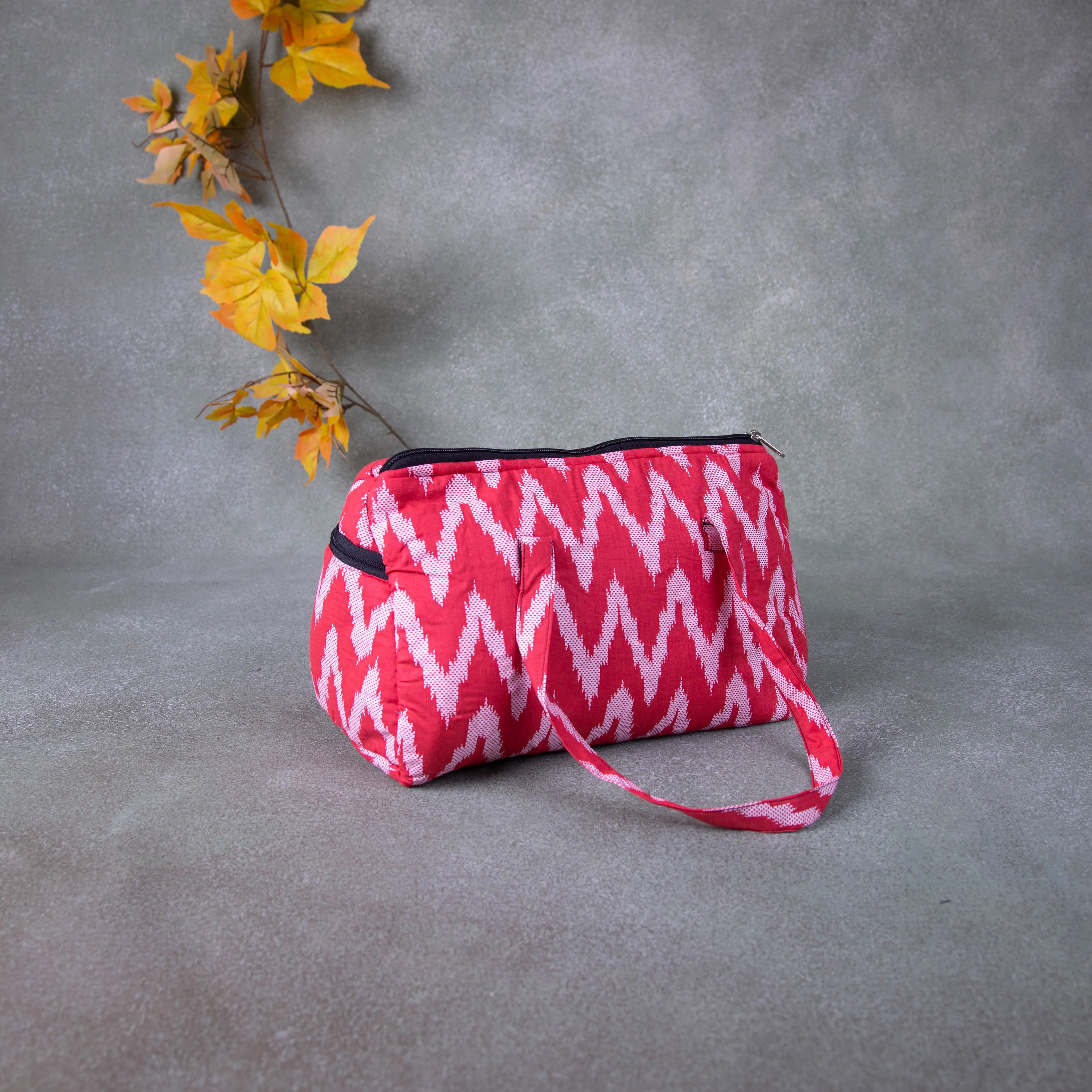 Barrel Handbags Red Colour with White zig zag Design.