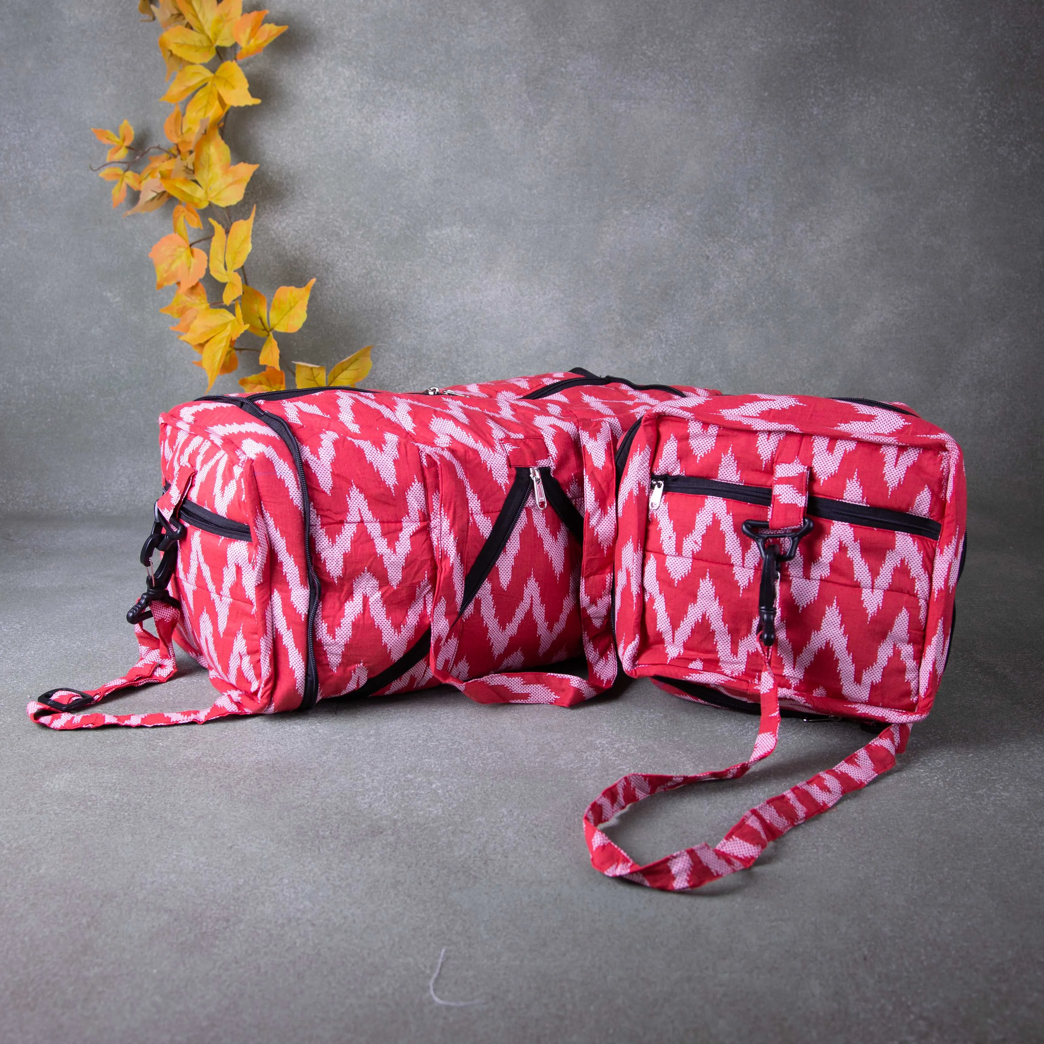 Expandable Travel Bag Pink Colour with White Vertical Zig Zag Design.